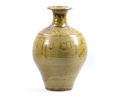 JIM MALONE (born 1946); a large stoneware bottle covered in green ash glaze, impressed JM mark, height 35cm. (D)   CONDITION 