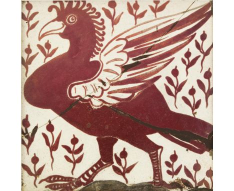 An early William De Morgan Great Curassow tile, painted with a bird amidst stylised foliage, in ruby lustre on a white ground