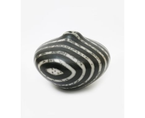 •Tim Andrews (born 1960) a large raku fired stoneware humbug vase, ovoid with solifleur neck, black and white strips with spo