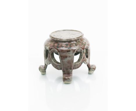 A Ruskin Pottery high-fired stoneware stand by William Howson Taylor, circular section on four feet with pierced decoration a