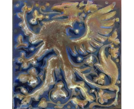 A Pilkington's tile designed by J. Henry Sellers, modelled in low relief with a lion rampant, in golden lustre in a blue lust