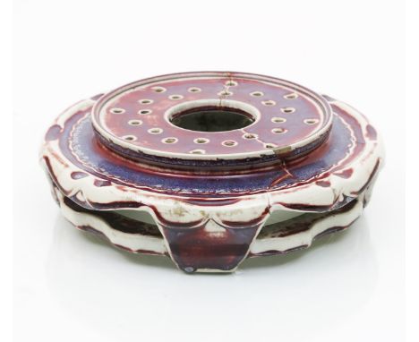 A large Ruskin Pottery high-fired stoneware stand by William Howson Taylor, circular, glazed in flambe and lavender over grey