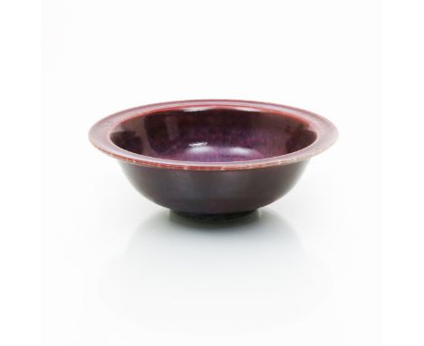 A Ruskin Pottery high-fired stoneware bowl by William Howson Taylor, dated 1916, covered in a rich flambe glaze with lavender