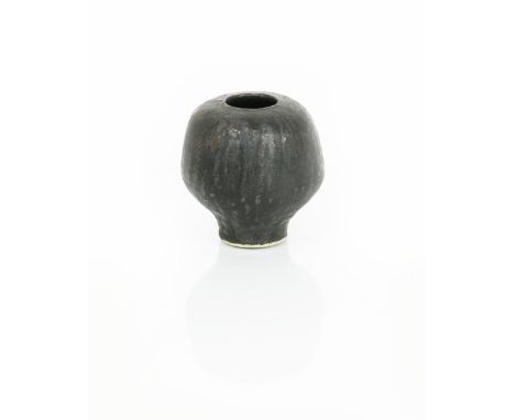 •Dame Lucie Rie D.B.E (1902-1995) a porcelain prune pot, rounded, footed form with inverted top rim, covered in a running man