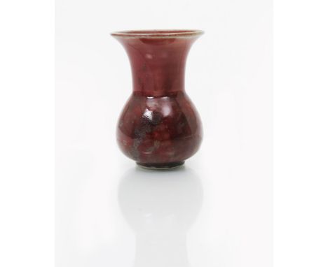 A small Ruskin Pottery high-fired stoneware vase by William Howson Taylor, dated 1921, ovoid body with cylindrical neck and e