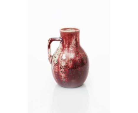 A Ruskin Pottery high-fired stoneware vase by William Howson Taylor, dated 1933, single-handled form, covered in a streaked f