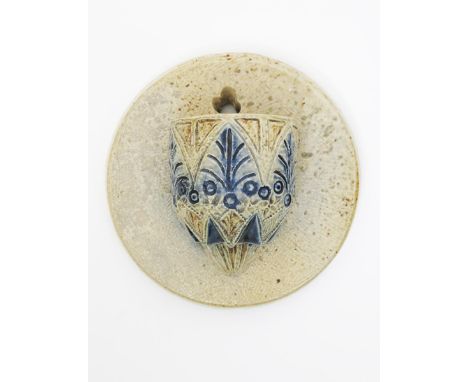 A Martin Brothers stoneware wall vesta by Robert Wallace Martin,  incised with stiff-leaf foliate design, glazed blue and buf