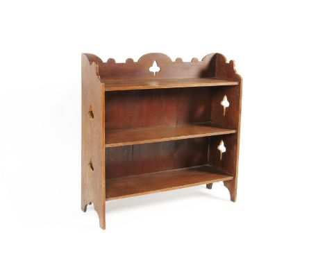 A stained oak shelf unit in the manner of Liberty & Co, and a freestanding bookshelf with pierced back and side panels, wall 