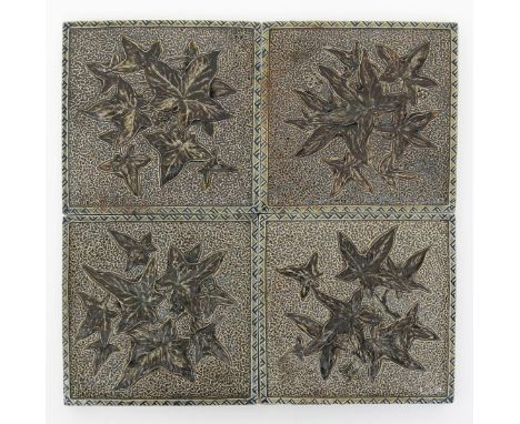 Four Martin Brothers stoneware tiles, one dated 1899, each modelled in low relief with ivy leaf design, inside simple chevron
