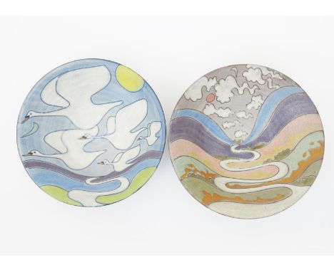 •Tessa Fuchs (born 1936) a large flaring bowl, painted to the well with five swans flying above a meandering river, in colour