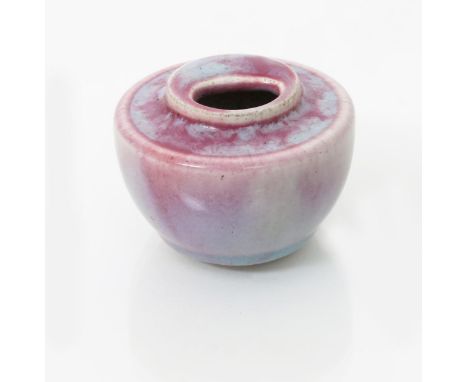 A Ruskin Pottery stoneware inkwell by William Howson Taylor, dated 1909, shape 19, covered in a Liver pink souffle glaze impr