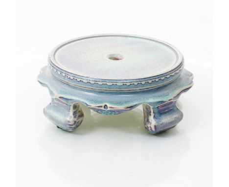 A Ruskin Pottery high-fired stoneware stand by William Howson Taylor,  on four feet, circular base, covered in a pale blue an