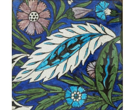 A William De Morgan Merton Abbey Persian large tile, square section, painted with a flower and foliate design in blue, green 