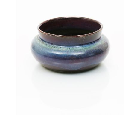 An early Ruskin Pottery high-fired bowl by William Howson Taylor,  on tocky body, shouldered form,  covered in a flambe glaze