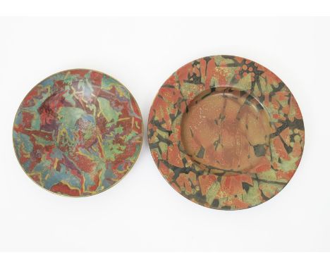 •Sutton Taylor (born 1943) an earthenware footed charger, decorated with abstract design in earth colours, and another Sutton