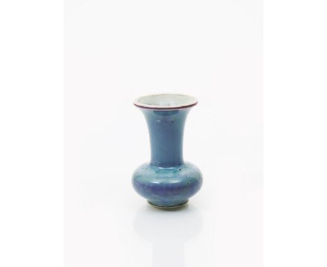 A Ruskin Pottery high-fired stoneware vase by William Howson Taylor, dated 1909, ovoid with flaring cylindrical neck,  covere