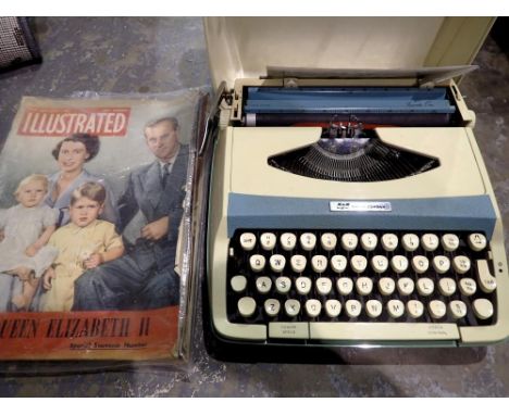 Smith Corona portable typewriter with instructions and royal commemorative ephemera. Not available for in-house P&amp;P 