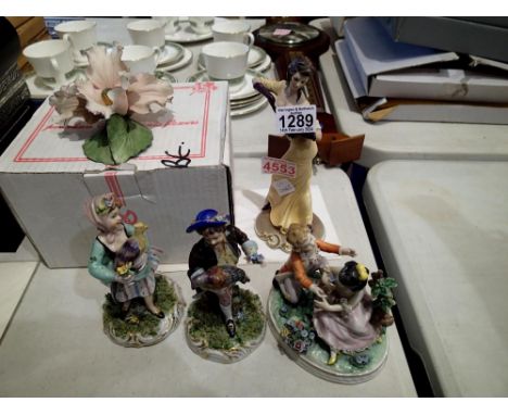 Four Capodimonte figures and a ceramic flower. Not available for in-house P&amp;P 