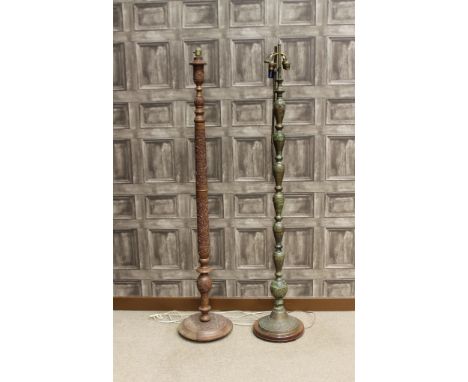 MID 20TH CENTURY EASTERN METAL STANDARD LAMPtogether with a carved wooden standard lamp, each 153cm high (2) 