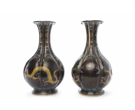 PAIR OF EARLY 20TH CENTURY CHINESE CLOISONNE VASESof lobed form with dragons chasing the flaming pearl, 33.5cm high