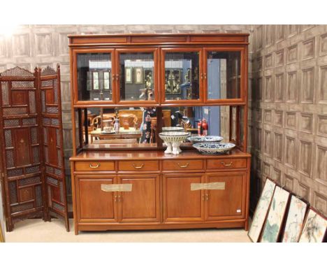 EARLY/MID 20TH CENTURY CHINESE ROSEWOOD CABINETin three sections, the lower section with cupboard doors, shelf and four drawe