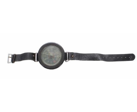 WWII Luftwaffe wrist compass on a leather strap, stamped AK 39 FI 23235-1 6cm diameter 
