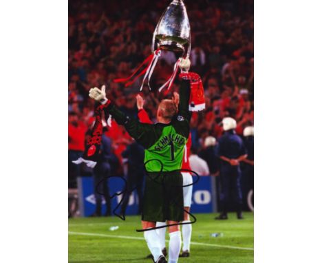 Football Peter Schmeichel signed 12x8 inch colour photo pictured with the Champions League Trophy while playing for Mancheste