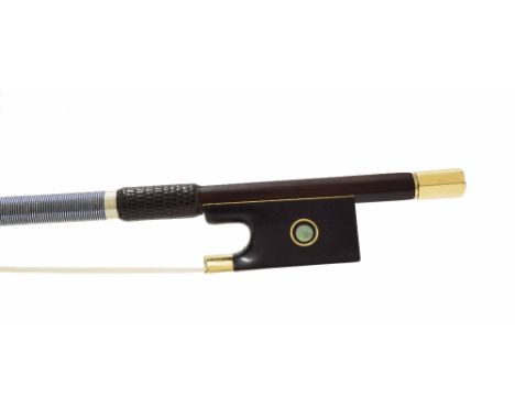 Fine and interesting gold mounted violin bow stamped C. Thomassin á Paris, the stick round, the ebony frog inlaid with gold r