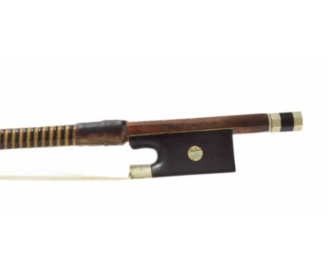 French nickel mounted violin bow stamped J. Pikadoulak, the stick round, the ebony frog inlaid with pearl eyes and the ebony 