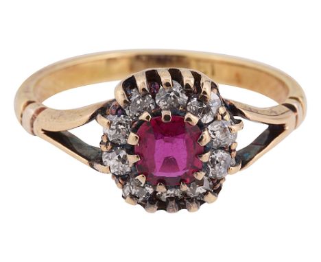 An Edwardian ruby and diamond-set cluster ringthe central oval mixed-cut ruby within a surround of old brilliant-cut diamonds