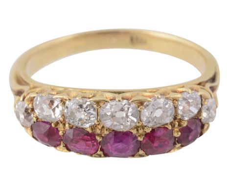 A ruby and diamond-set ring,  set with a line of cushion-shaped old brilliant-cut diamonds and another of cushion-shaped rubi