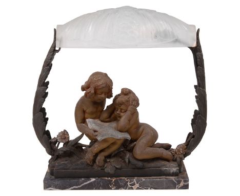 A French spelter and marble figural table lamp, early 20th centurythe two reading girls on a marble base and enclosed by leaf