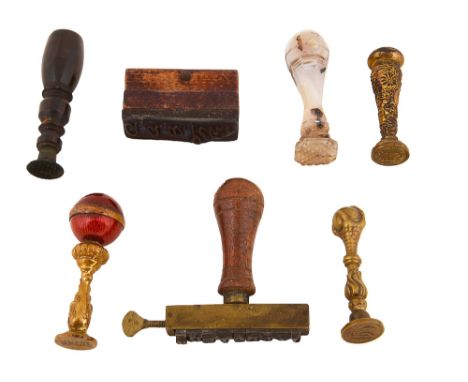 Victorian and later desk seals and stamps to include a an agate seal with hatched matrix, a gilt brass seal with red guilloch