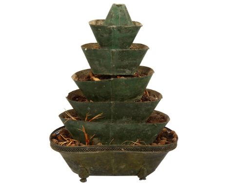 A late 19th century French tiered green tole planter formed of eight graduated tiers, on paw feetheight 48 cm.Condition:Sligh