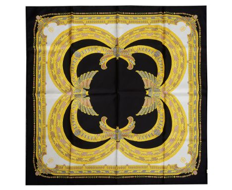 A Must De Cartier silk scarfdecorated against the black coloured ground, in scarab beetle and panther design, Made in Paris, 