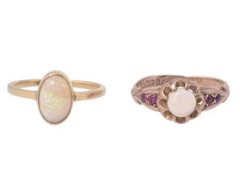 Two cabochon opal ringsthe first set with two rubies to each shoulder, the 9ct yellow gold shank Chester hallmark 1915; the s