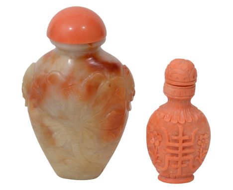 A Chinese carved coral snuff bottle and stopper and a russet celadon jade snuff bottle and stopper early 20th centuryfirst of