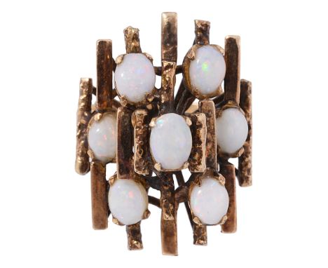 A 1970s opal doublet set abstract design ring geometric design, openwork of tiered textured and polished bars set with seven 