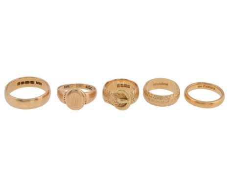 A 22ct gold ring and four 18ct gold ringsthe 22ct ring plain, the large 18ct ring plain, a signet ring, monogrammed, another 