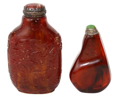 Two Chinese amber snuff bottles and stoppersQing/Republican first relief carved with lion mask ring handles, phonenix and dra