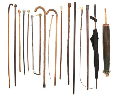 A collection of eighteen canes, walking sticks, riding crops and umbrellasthe six walking sticks to include a lacewood and si