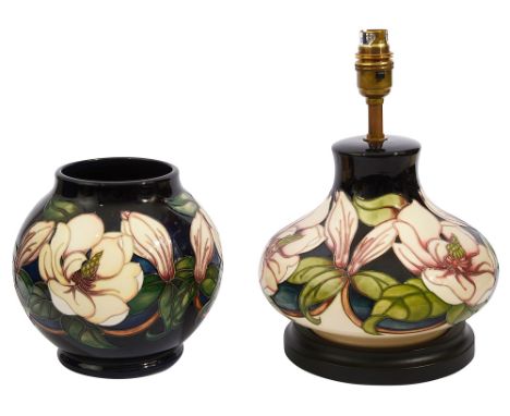 A Moorcroft 'Magnolia' pattern lamp and vasetube lined and with impressed maker's stamps, the lamp of squat baluster form, ma