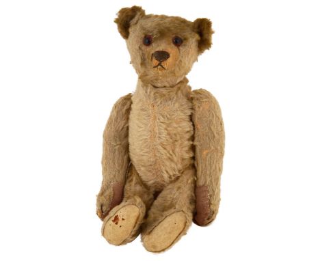 An early 20th century Steiff teddy bear German, silver/ grey blonde coloured mohair, clipped muzzle, amber and black glass ey