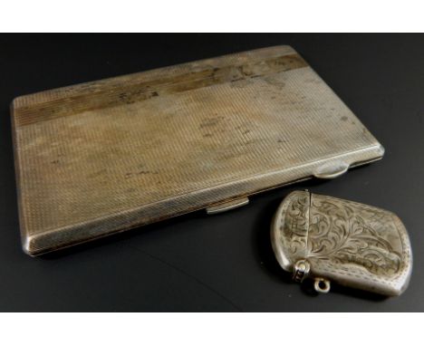 A George VI silver cigarette case, the rectangular engine turned body hinging to reveal a fitted interior, 14cm wide and a Ch