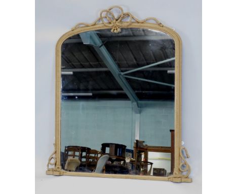 A Victorian gilt wood overmantel mirror, of arched outline with a rope twist double border, surmounted by a ribbon and tassel