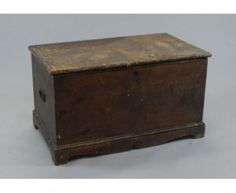 A 19thC stained pine tool chest, the overhanging top hinging to reveal a plain interior, on a carved apron base, with stylise