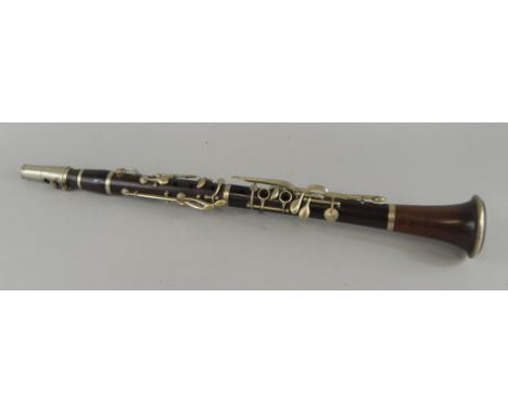 An early 20thC rosewood clarinet, with silver plated mounts, the mouth piece stamped Boosey, the neck stamped A Davies, 59cm 