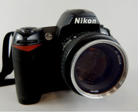 A Nikon D70S digital camera, with Nikkor 50mm lens.