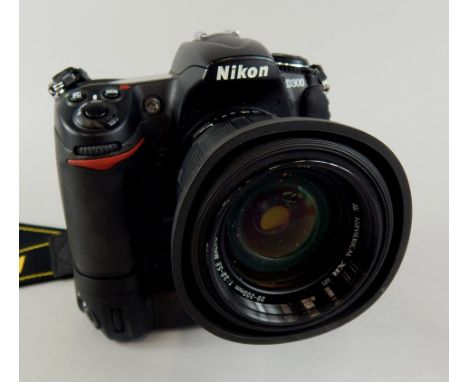 A Nikon D300 digital camera, with motor drive and Tamron auto-focus 27 espherical XR 200mm lens.