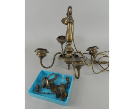 A modern four branch gilt metal chandelier.